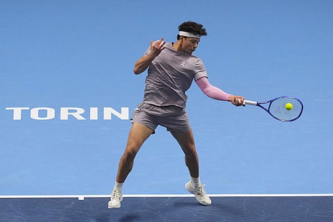 United States' Ben Shelton returns the ball to Canada's Felix Auger-Aliassime during their tennis match of the ATP World Tour Finals, in Turin, Italy.
