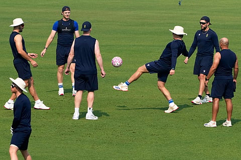 South Africa cricketers play football during the practice session ahead of the first test match between India and South Africa, in Kolkata.