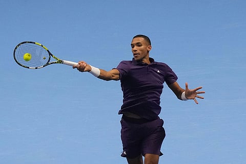 Canada's Felix Auger-Aliassime returns the ball to United States' Ben Shelton during their tennis match of the ATP World Tour Finals, in Turin, Italy.