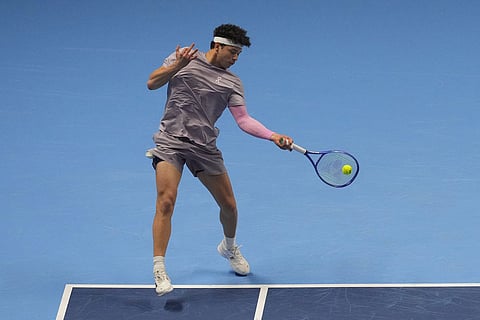 United States' Ben Shelton returns the ball to Canada's Felix Auger-Aliassime during their tennis match of the ATP World Tour Finals, in Turin, Italy.