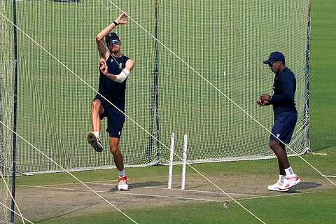 South Africa's Marco Jansen, left, bowls at net as Senuran Muthusamy, right, waits for his turn during the practice session ahead of the first test match between India and South Africa, in Kolkata.