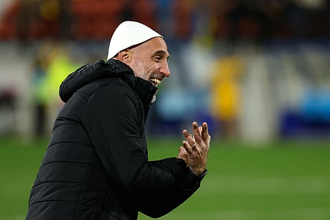 Albania's assistant coach Pablo Zabaleta, from Argentina, celebrates at the end of a World Cup 2026 group K qualifying soccer match between Andorra and Albania in Encamp, Andorra.