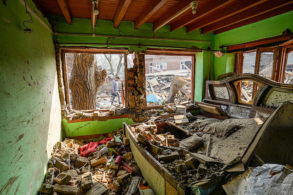 | Photo: PTI/S Irfan : Debris at the site after the house of Dr Umar Nabi, who drove the explosive-laden car involved in the Delhi blast, was demolished by security forces, in Jammu and Kashmir's Pulwama district. The demolition was carried out during the intervening night of Thursday and Friday, according to officials. 