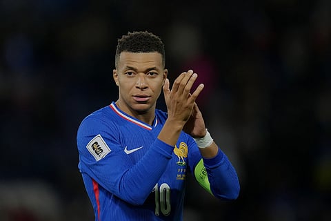 France's Kylian Mbappe celebrates after wining a World Cup 2026 group D qualifying soccer match against Ukraine in Paris.