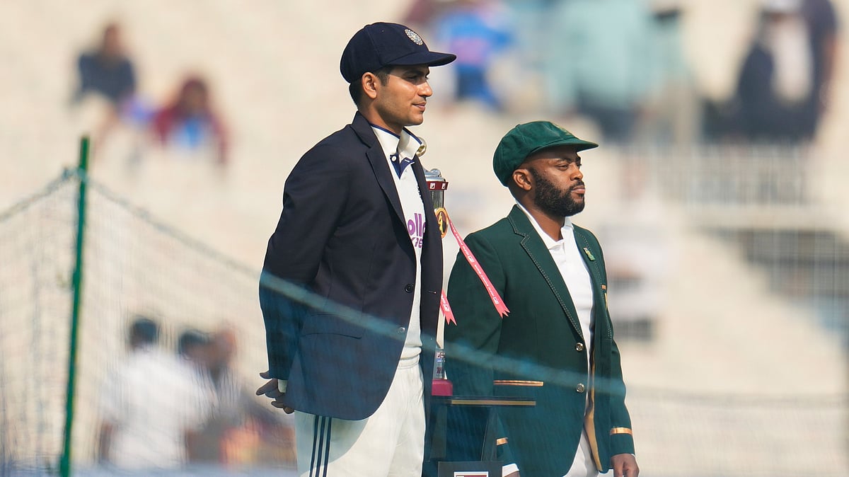 (AP Photo/Aijaz Rahi) : India Vs South Africa Toss Update, 1st Test: India's captain Shubman Gill, left, and South Africa's captain Temba Bavuma pose with the trophy before the start of of the first day of the first cricket test match between India and South Africa in Kolkata, India, Friday, Nov. 14, 2025. 
