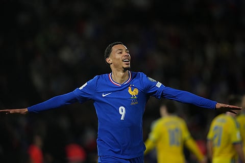 France's Hugo Ekitike celebrates his side's fourth goal during a World Cup 2026 group D qualifying soccer match between France and Ukraine in Paris.
