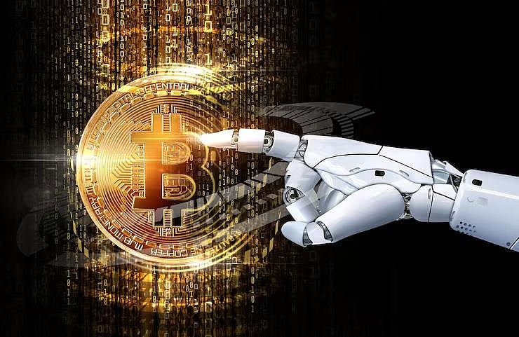 Robot hand touches Bitcoin