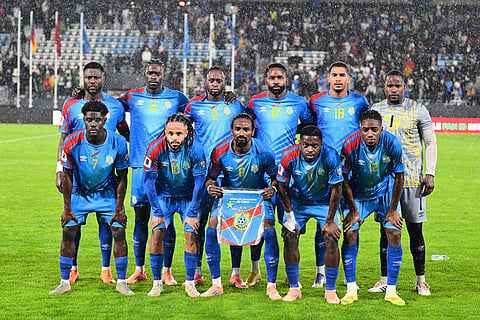 Congo's starting 11 pose for a group photo before a World Cup qualifying soccer match against Cameroon in Rabat, Morocco. 