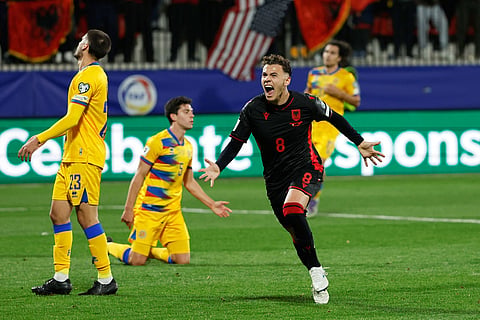 Albania's Kristjan Asllani celebrates after scoring the opening goal during a World Cup 2026 group K qualifying soccer match between Andorra and Albania in Encamp, Andorra.