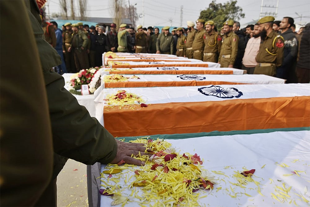 The coffins of the deceased during the wreath-laying ceremony