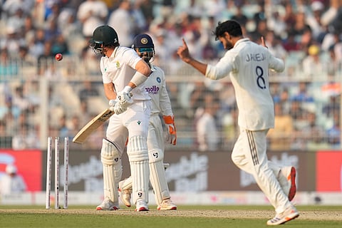 India's Ravindra Jadeja, right, celebrates the dismissal of South Africa's Tristan Stubbs, left, on the second day of the first cricket test match between India and South Africa in Kolkata.