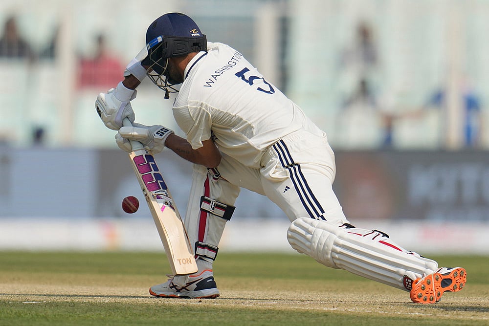 | Photo: AP/Aijaz Rahi : India's Washington Sundar bats on the second day of the first cricket test match between India and South Africa in Kolkata.