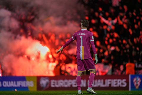Croat fans burn flares during a World Cup 2026 group L qualifying soccer match between Croatia and Faroe Islands in Rijeka, Croatia.