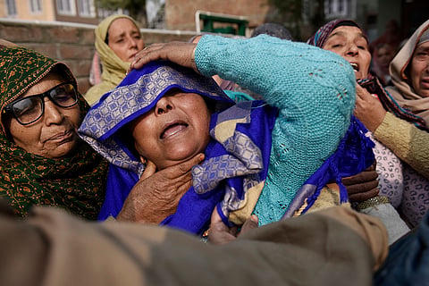Relatives stage a protest demanding the mortal remains of Mohammad Shafi Parry, a tailor who was killed in an accidental explosion which ripped through Nowgam police station on late Friday night, in Srinagar.