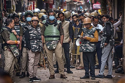 Security personnel deployed during demolition of an alleged illegal house at Dalmandi, in Varanasi.