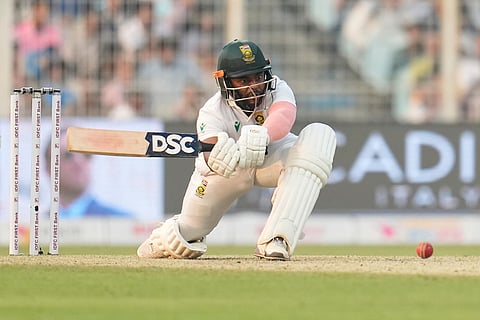 South Africa's captain Temba Bavuma plays a shot on the second day of the first cricket test match between India and South Africa in Kolkata.