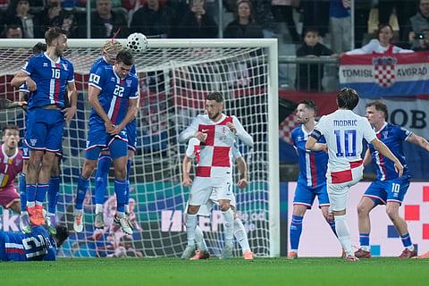 Faroe Islands' Jakup Andreasen defends free kick by Croatia's Luka Modric during a World Cup 2026 group L qualifying soccer match between Croatia and Faroe Islands in Rijeka, Croatia.