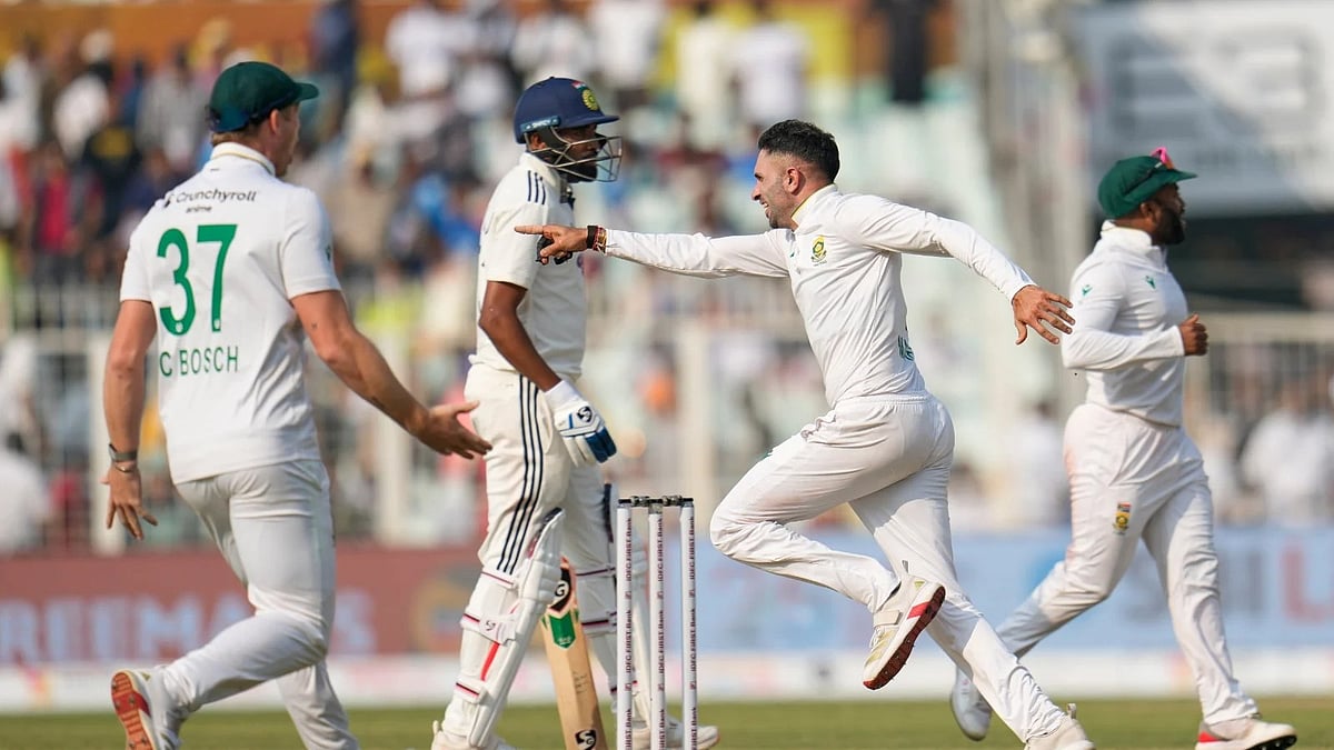 AP Photo/Aijaz Rahi : South Africa's Keshav Maharaj, second right, and teammates celebrate after their win on the third day of the first cricket test match against India in Kolkata, India, Sunday, Nov. 16, 2025