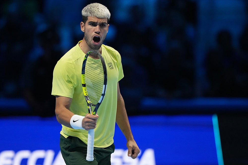 | Photo: AP/Antonio Calanni : Spain's Carlos Alcaraz celebrates after winning semifinal tennis match of the ATP World Tour Finals against Canada's Felix Auger-Aliassime, in Turin, Italy.