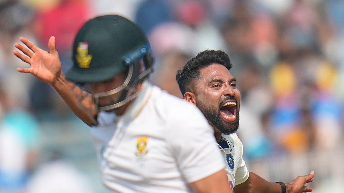 (AP Photo/Aijaz Rahi) : India's Mohammed Siraj celebrates the dismissal of South Africa's Keshav Maharaj, front, on the third day of the first cricket test match between India and South Africa in Kolkata, India, Sunday, Nov. 16, 2025.