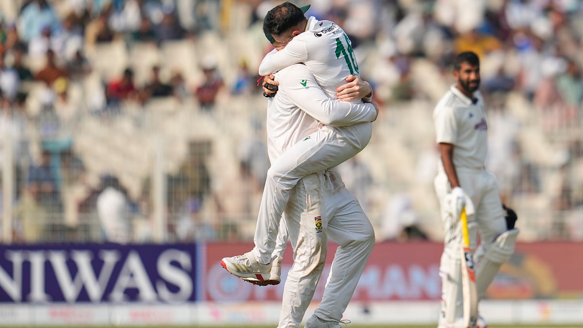 AP Photo/Aijaz Rahi : India's Jasprit Bumrah, right, watches as South Africa's Simon Harmer, left, and Keshav Maharaj celebrate after winning the first cricket test match against India in Kolkata, India, Sunday, Nov. 16, 2025