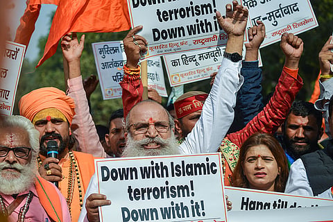 BJP leader and International Working President of the United Hindu Front Jai Bhagwan Goyal, center, and others raise slogans during a protest against the recent blast near the Red Fort, at Jantar Mantar, in New Delhi.