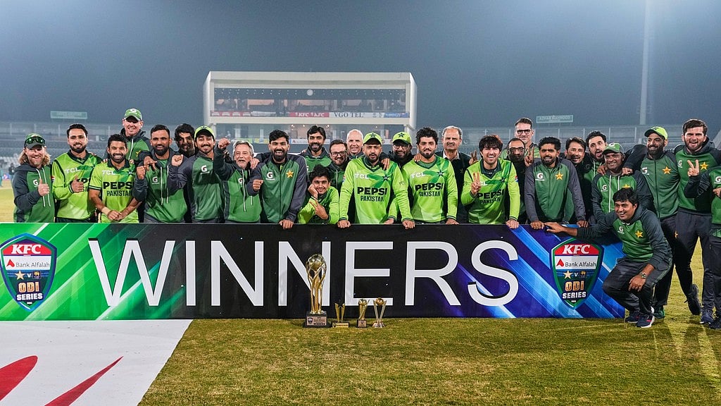 AP : Pakistan players and officials pose with the trophy after winning the ODI series against Sri Lanka in Rawalpindi.