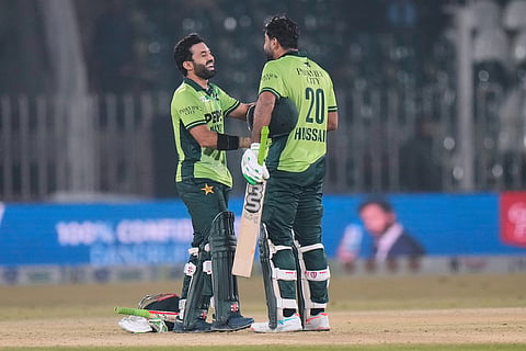 Pakistan's Mohammad Rizwan, left, celebrate with Hussain Talat after winning the third one day international cricket match against Sri Lanka, in Rawalpindi, Pakistan.