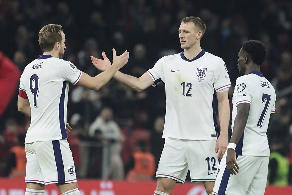 | Photo: AP/Vlasov Sulaj : England's Harry Kane, left, shares hands with England's Dan Burn after the World Cup 2026 group K qualifying soccer match between Albania and England, in Tirana, Albania.