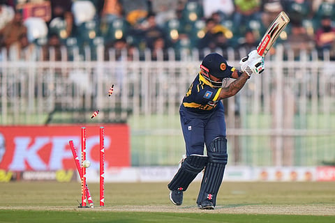 Sri Lanka's Kusal Mendis is bowled out by Pakistan's Mohammad Wasim during the third one day international cricket match between Pakistan and Sri Lanka, in Rawalpindi, Pakistan.