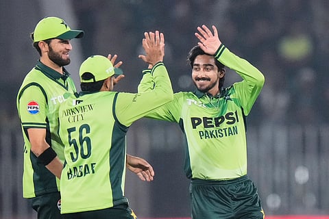 Pakistan's Faisal Akram, right, celebrates with teammates after the dismissal of Sri Lanka's Sadeera Samarawickrama during the third one day international cricket match between Pakistan and Sri Lanka, in Rawalpindi, Pakistan.