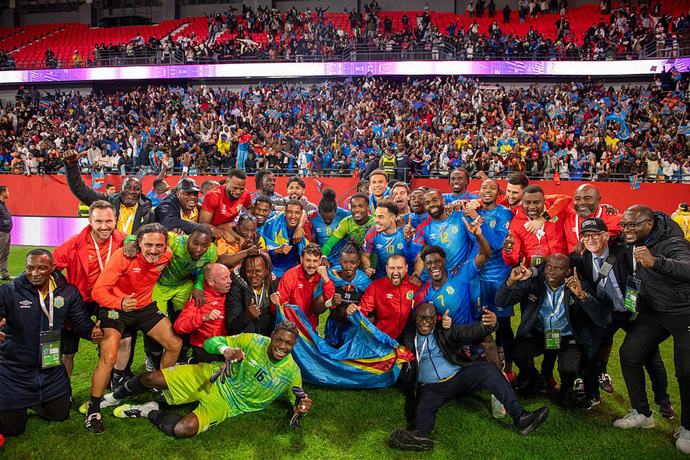 | Photo: AP : Congo national team members pose for a photo as they celebrate with their coach Sebastien Desabre after being qualified for the FIFA 2026 soccer World Cup in the African qualifier final match against Nigeria, in Rabat, Morocco.