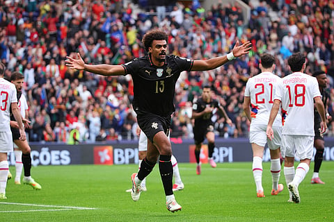 Portugal's Renato Veiga celebrates after scoring the opening goal during a World Cup 2026 group F qualifying soccer match between Portugal and Armenia in Porto, Portugal.