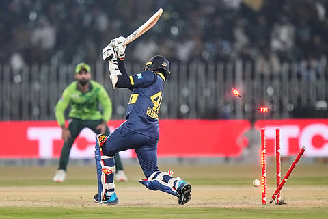 Sri Lanka's Jeffrey Vandersay is bowled out by Pakistan's Mohammad Wasim during the third one day international cricket match between Pakistan and Sri Lanka, in Rawalpindi, Pakistan.
