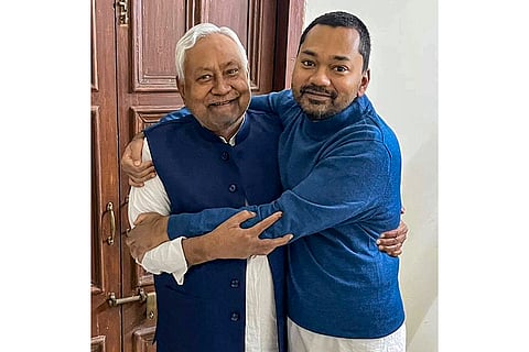 Bihar Chief Minister Nitish Kumar with his son Nishant Kumar at his official residence, in Patna.