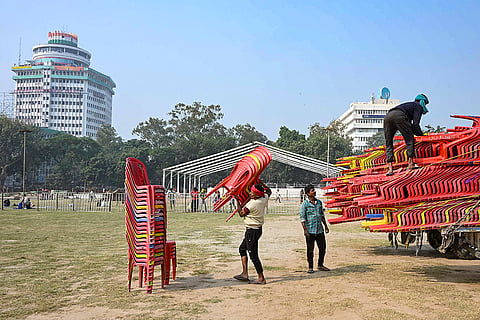 Workers prepare the venue for the swearing-in ceremony of the new government in Bihar, in Patna.