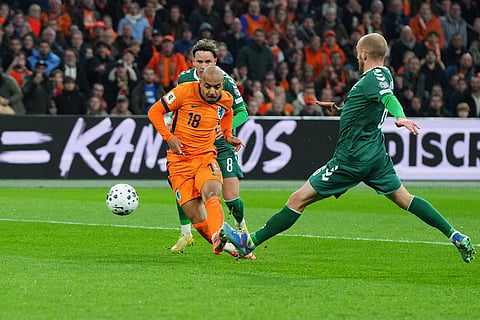 Netherlands' Donyell Malen (18) scores his side's 4th goal during a World Cup 2026 group G qualifying soccer match between Netherlands and Lithuania in Amsterdam, Netherlands.