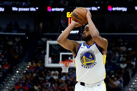 Golden State Warriors guard Moses Moody shoots a three-pointer against the New Orleans Pelicans during the first quarter of an NBA basketball game in New Orleans.