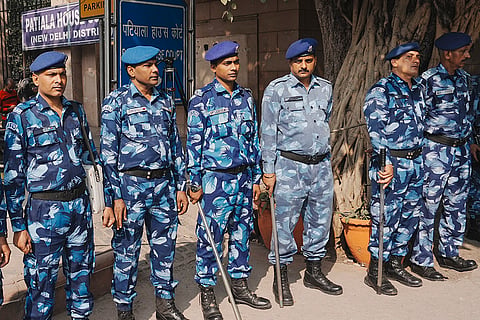 Rapid Action Force (RAF) personnel outside the Patiala House Court that received a bomb threat, in New Delhi. Multiple courts in Delhi, along with two CRPF-run schools, received bomb threats on Tuesday morning. 