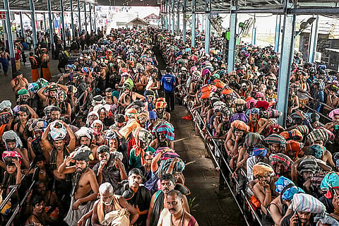 People arrive to offers prayers at the Sabarimala temple during the Malayalam month of 'Vrichikam', in Pathanamthitta district, Kerala.