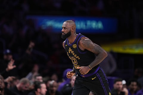 Los Angeles Lakers forward LeBron James (23) makes his way down the court after making a basket during the first half of an NBA basketball game against the Utah Jazz in Los Angeles.
