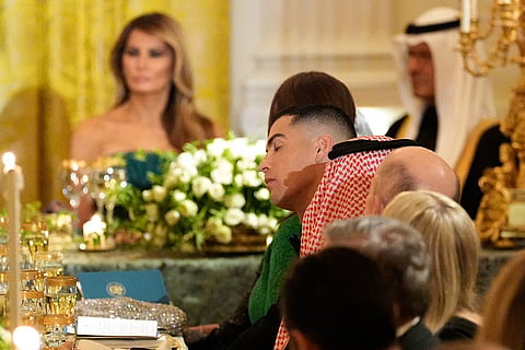Cristiano Ronaldo, center, attends a dinner with President Donald Trump and Saudi Arabia's Crown Prince Mohammed bin Salman in the East Room of the White House in Washington. 