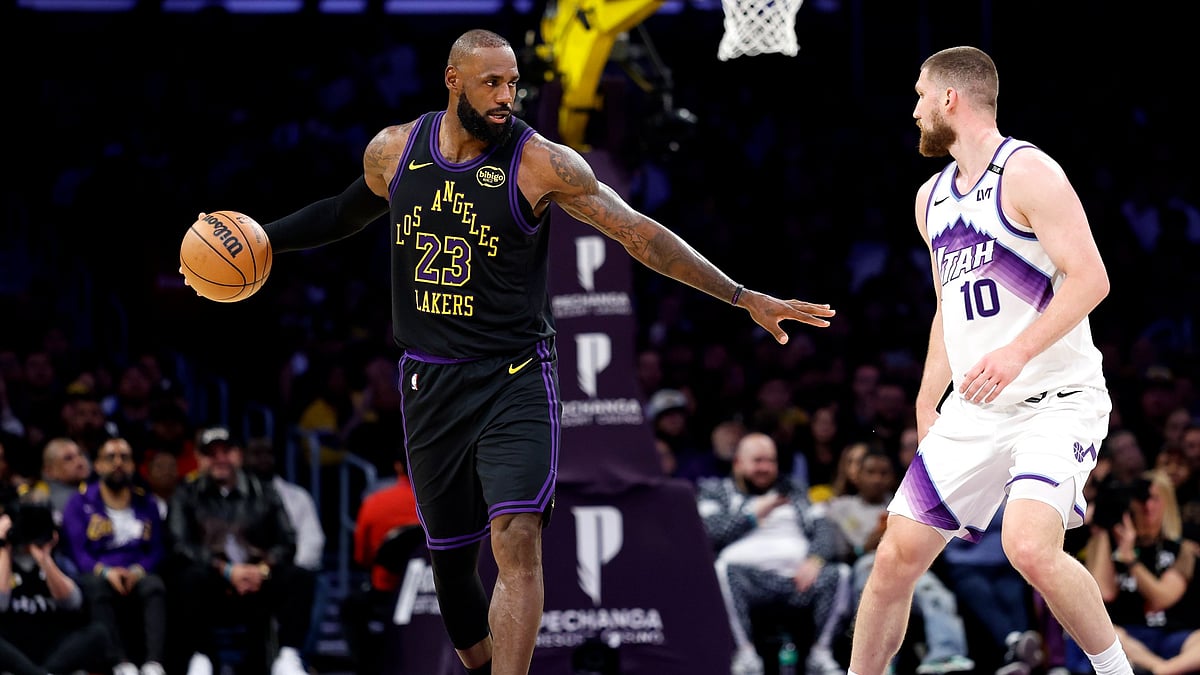 LeBron James #23 of the Los Angeles Lakers dribbles the ball against Svi Mykhailiuk #10 of the Utah Jazz during the second half at Crypto.com Arena on November 18, 2025 in Los Angeles, California.