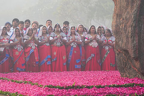 People from Gujarat tribal community pay tribute to former PM Indira Gandhi on her birth anniversary, at Shakti Sthal in New Delhi.