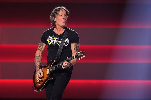 Keith Urban performs during the 59th Annual Country Music Association Awards at Bridgestone Arena in Nashville, Tennessee. 