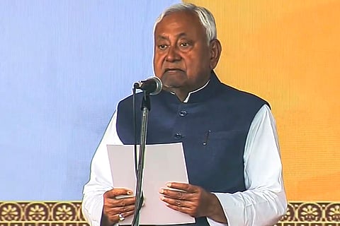 JD(U) supremo Nitish Kumar takes oath as the Chief Minister of Bihar during the swearing-in ceremony, at Gandhi Maidan in Patna. Nitish took the oath as CM for a record 10th time. 