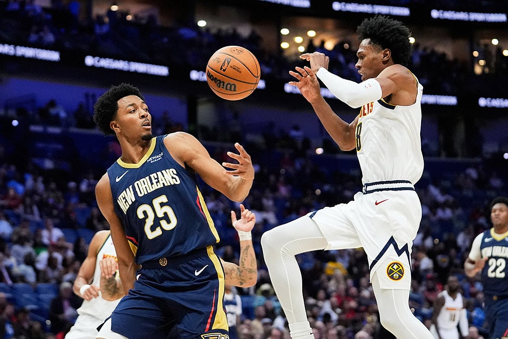 | Photo: AP/Gerald Herbert : Denver Nuggets guard Peyton Watson (8) loses the ball against New Orleans Pelicans forward Trey Murphy III (25) in the second half of an NBA basketball game in New Orleans. 