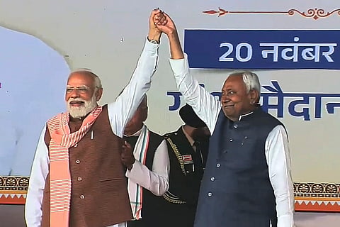 Prime Minister Narendra Modi with newly sworn-in Bihar Chief Minister Nitish Kumar during the swearing-in ceremony, at Gandhi Maidan in Patna.