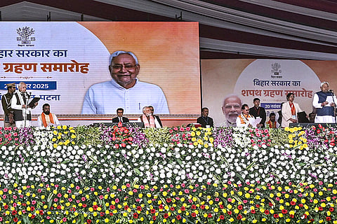 Bihar Governor Arif Mohammad Khan administers the oath to Nitish Kumar as the Chief Minister of Bihar in the presence of Prime Minister Narendra Modi during the swearing-in ceremony, at Gandhi Maidan in Patna.