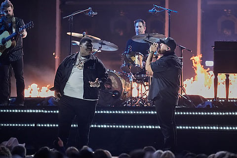 BigXthaPlug, left, and Luke Combs perform "Pray Hard during the 59th Annual Country Music Association Awards at Bridgestone Arena in Nashville, Tennessee. 